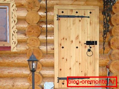 Wooden door on the hinges