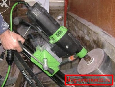 Diamond drilling holes in concrete under the plumbing