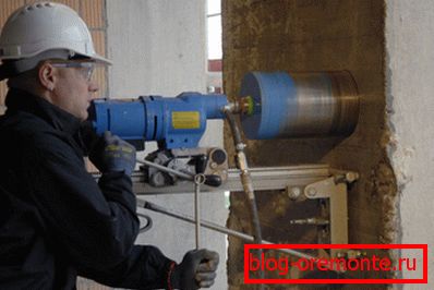 Diamond drilling of holes in concrete using a special power tool. Diamond drilling of holes in concrete using a special power tool.