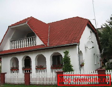 White house with a red tile roof