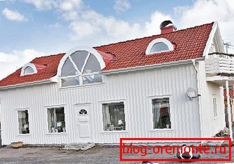 White siding with red tiles