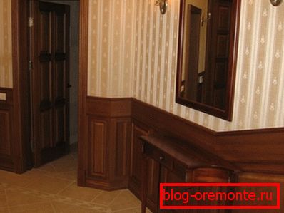 Wooden paneled door in classic interior Wooden paneled door in classic interior