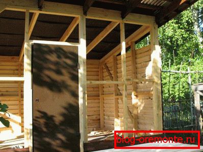 Installation of the door to the shed with a single-pitch roof