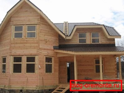 Two-storey log house. Two-storey log house.