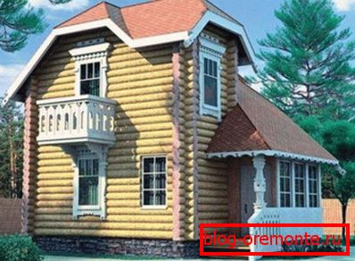 Two-level wooden house with a veranda. Two-level wooden house with a veranda.