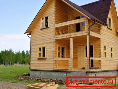 Photo of a 2-storey house made of timber Photo of a 2-storey house made of timber