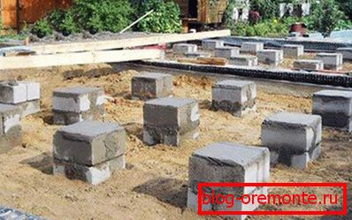Photo of the ready support-column basement from cement blocks Photo of the ready support-column basement from cement blocks