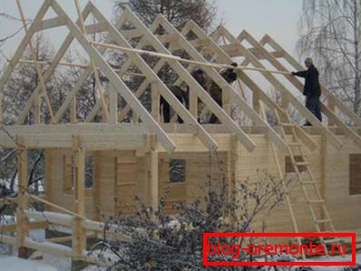 Photo of the roof frame made of boards. Photo of the roof frame made of boards.