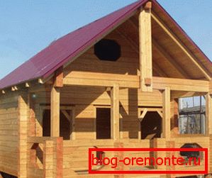 Photo of the process of building a house of timber