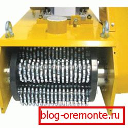 Mill for concrete. Drum with high-strength steel cutters Mill for concrete. Drum with high-strength steel cutters