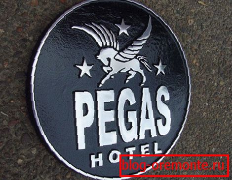 Metal signboard with brand logo