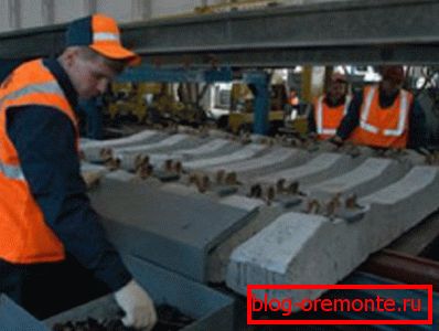 Installation of rail and concrete sleepers before laying on the embankment Installation of rail and concrete sleepers before laying on the embankment