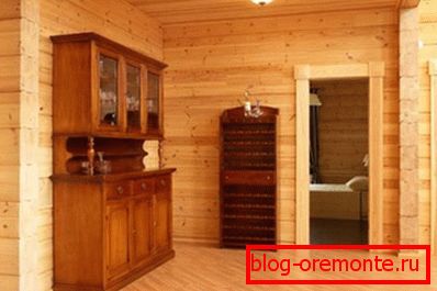 The photo shows the interior of the log house. The photo shows the interior of the log house.