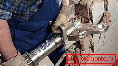 In the photo - the use of electro-hydraulic equipment for breaking partitions In the photo - the use of electro-hydraulic equipment for breaking partitions