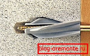 On the photo is a herringbone self-tapping screw On the photo is a herringbone self-tapping screw