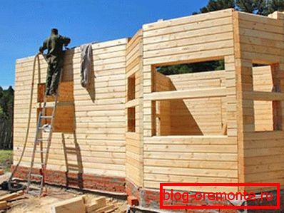 In the photo - the construction of log houses. In the photo - the construction of log houses.