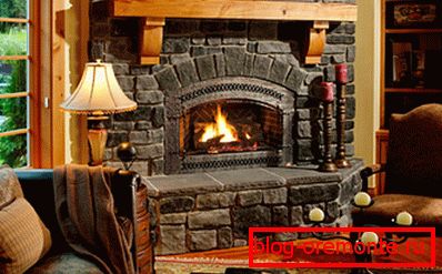 In the photo - the interior with a fireplace. In the photo - the interior with a fireplace.