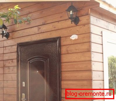 The photo shows a house with exterior trim imitation timber. The photo shows a house with exterior trim imitation timber.