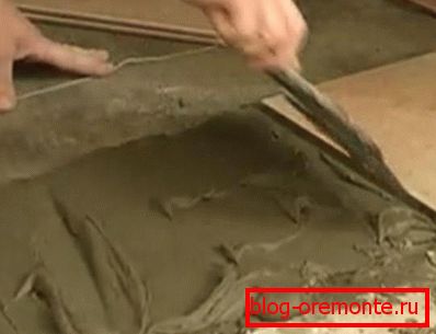 Applying a bonding mixture porch tiling