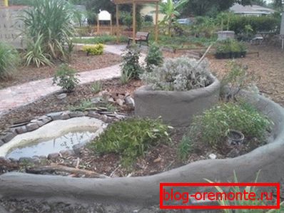 Original concrete flower garden on the plot Original concrete flower garden on the plot