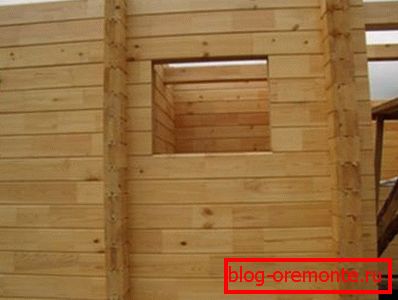 An example of a log wall with window openings. An example of a log wall with window openings.
