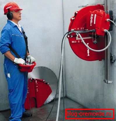 Cutting a concrete wall with a diamond disc Cutting a concrete wall with a diamond disc