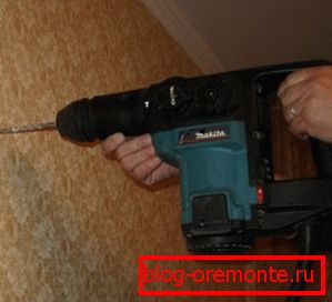 Drilling a concrete wall with a perforator
