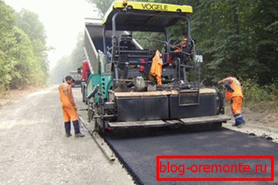 Laying asphalt using special equipment. Laying asphalt using special equipment.
