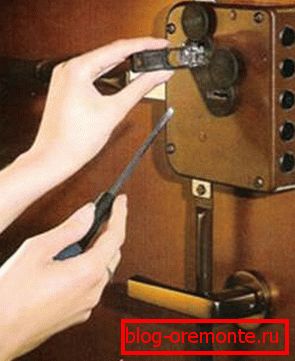 installation of a lock on a metal door