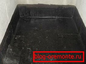 The device of a concrete floor in a bath - we lay waterproofing The device of a concrete floor in a bath - we lay waterproofing