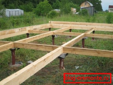 Screw piles with wooden top grillage Screw piles with wooden top grillage