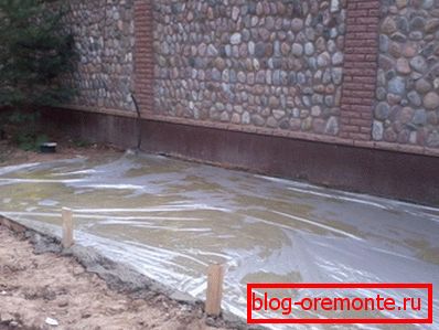 During the rain, fresh concrete is covered with foil. During the rain, fresh concrete is covered with foil.