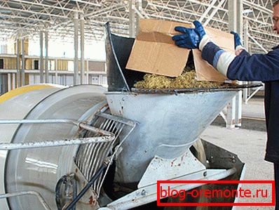 Loading components into a concrete mixer Loading components into a concrete mixer