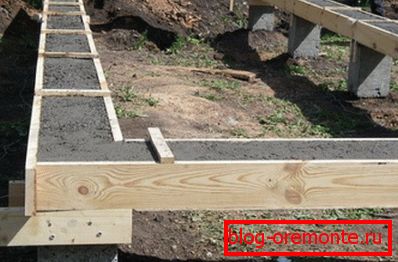 The formwork filled in with concrete for creation of a small grillage The formwork filled in with concrete for creation of a small grillage
